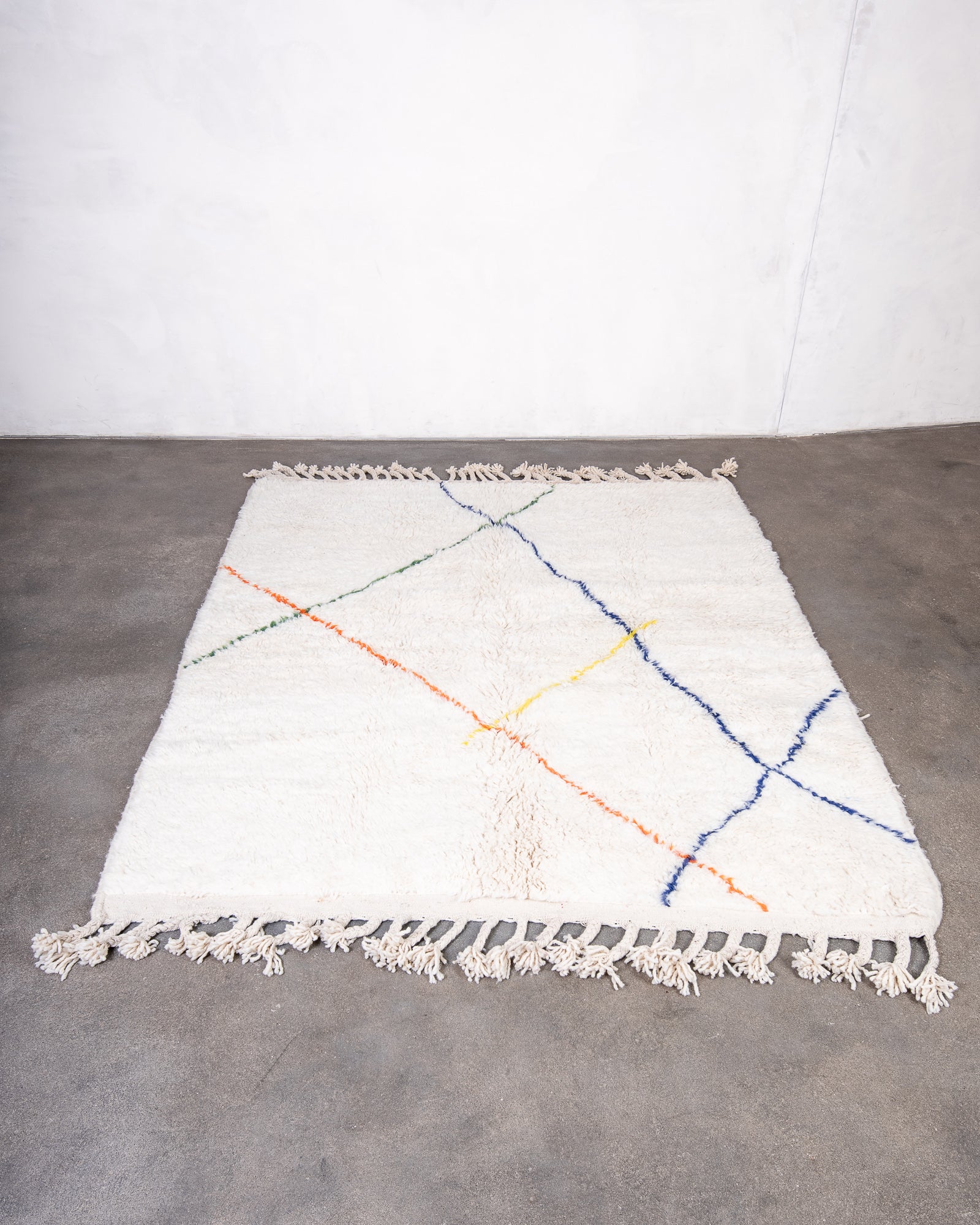 Modern, designer, handcrafted Berber rug from Morocco. Beniourain carpet with beautiful colours and patterns and fluffy wool texture.